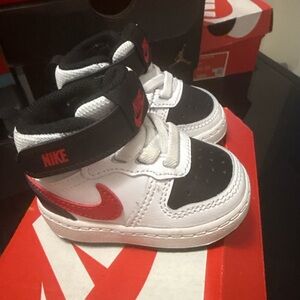 Nike Kids' White and Black Sneakers with Red Swoosh